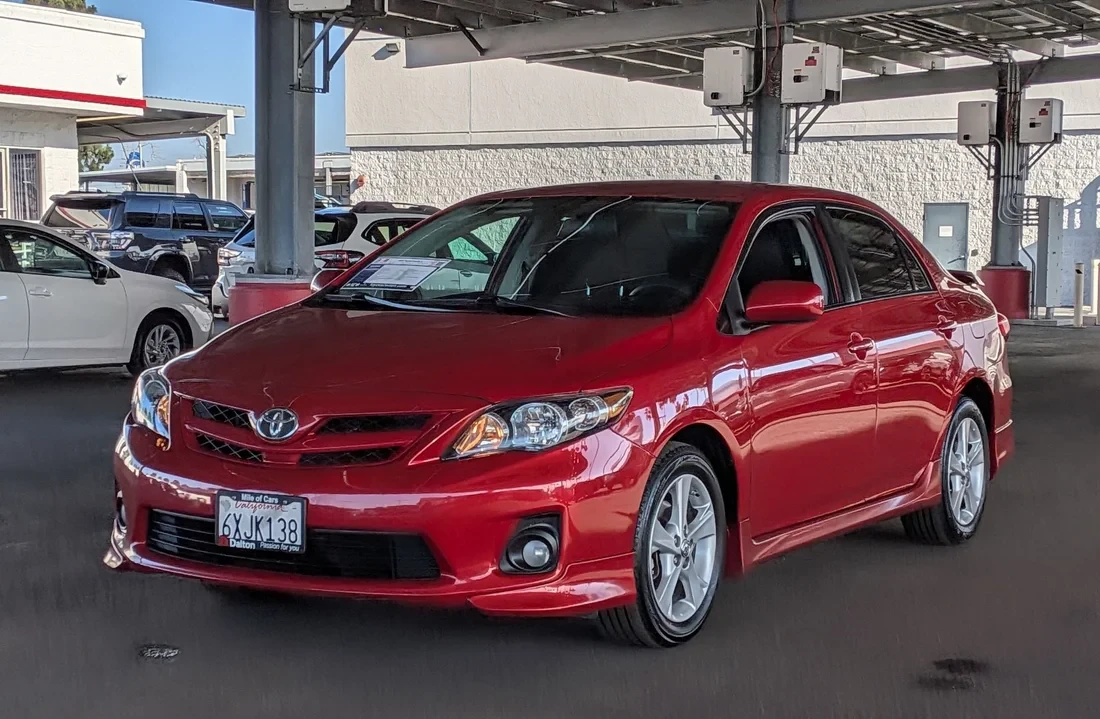 A used Toyota Corolla on the Dalton Toyota National City lot, with the Mile of Cars dealer plate frame.