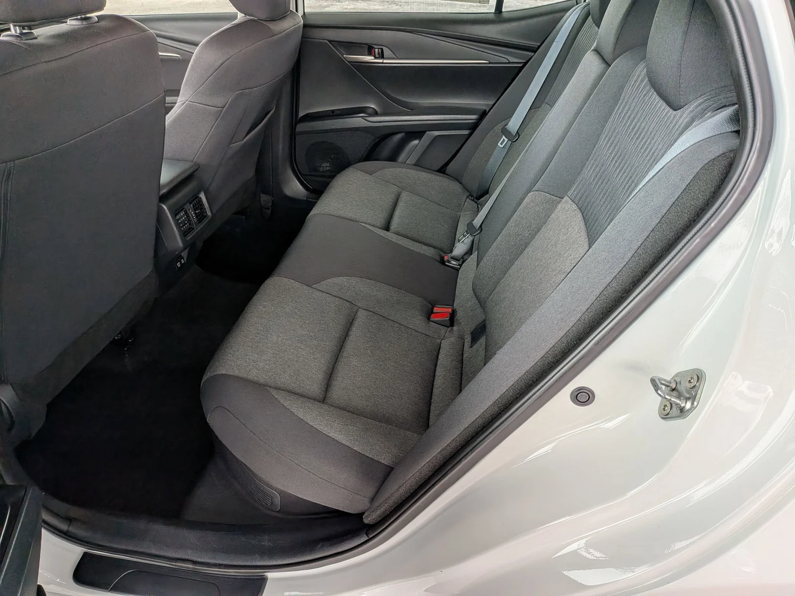 Rear seats of a used Toyota Camry with center armrest